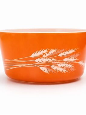 Vintage Pyrex 474-B Cinderella mixing bowl in classic orange wheat pattern.
